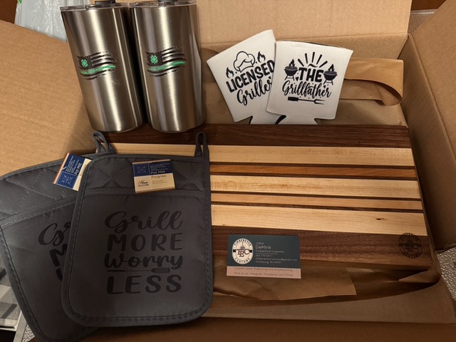 Two metal 4h cups and oven mitts.jpeg